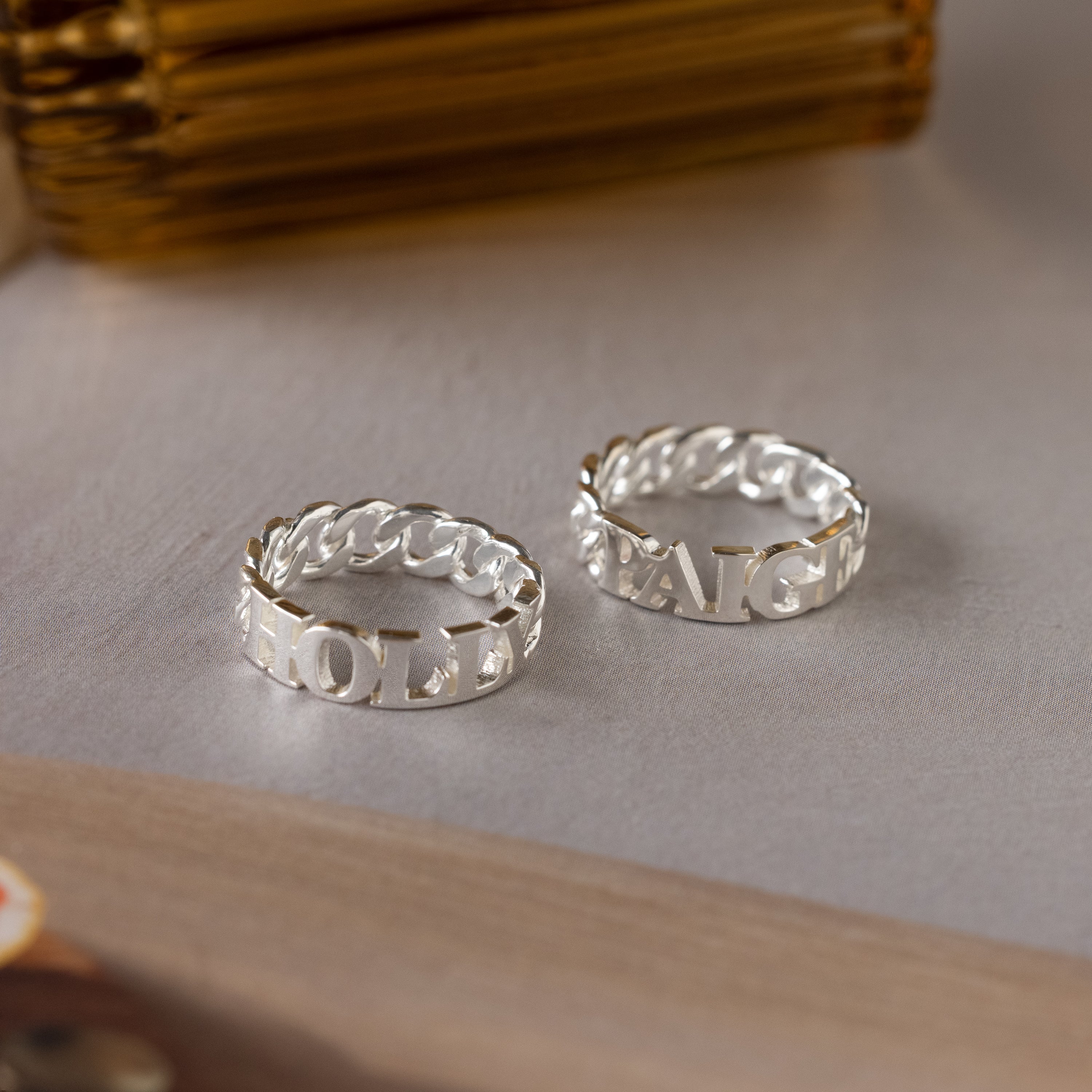 Newsletter Curb Name Ring in Silver