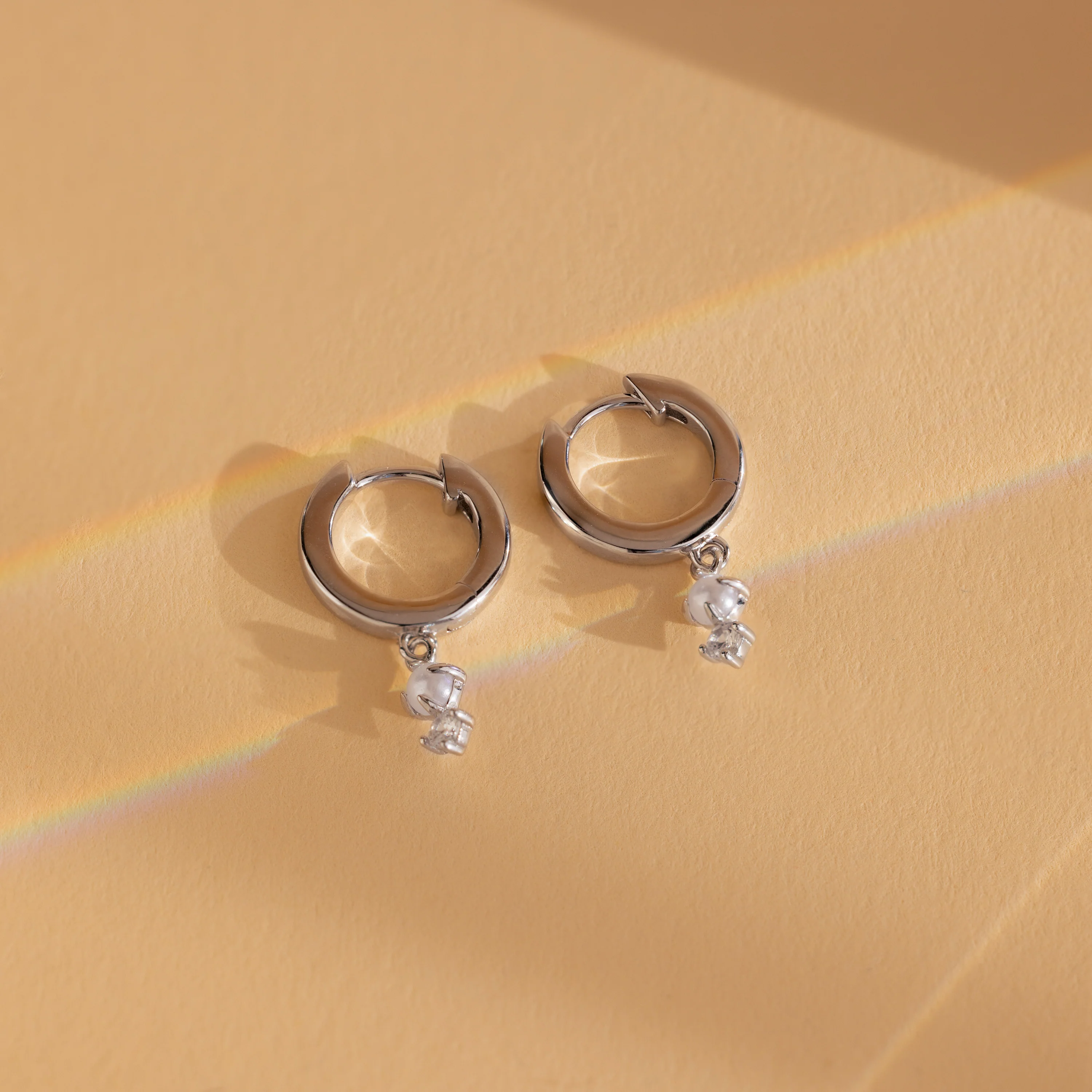Dangling Pearl Diamond Huggies in Silver - Image 3