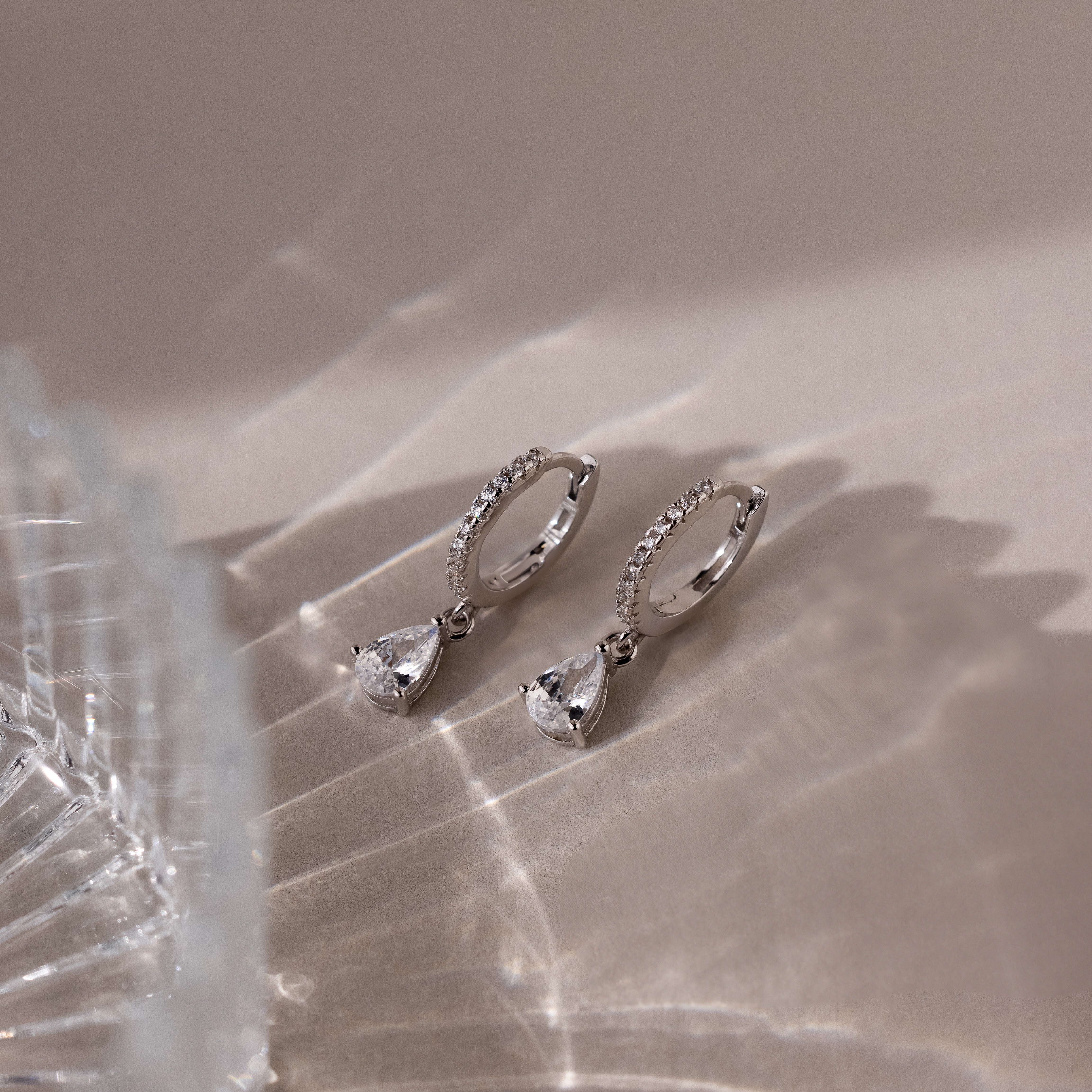 Diamond Drop Huggies in 18K Gold