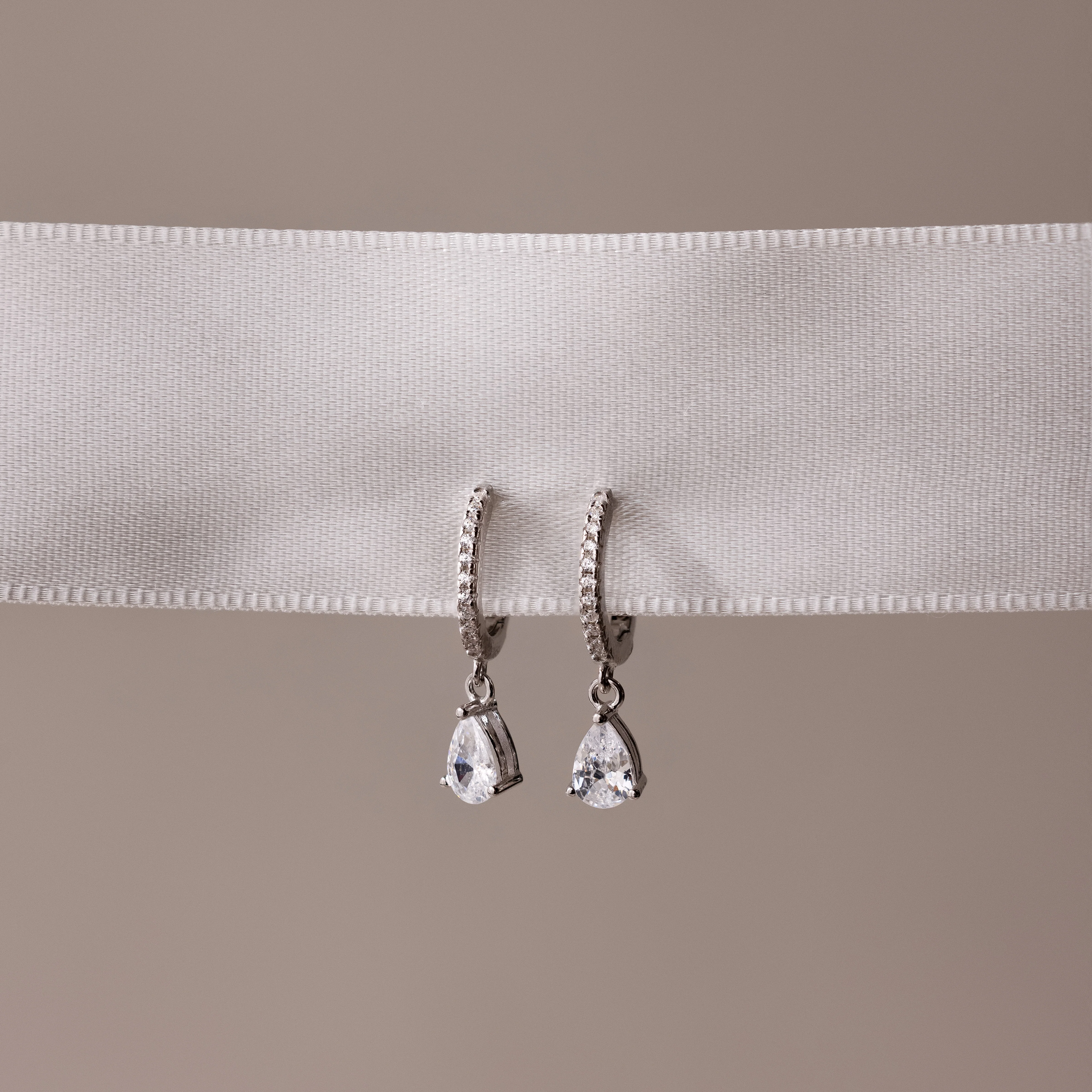 Diamond Drop Huggies in 18K Gold - Image 2