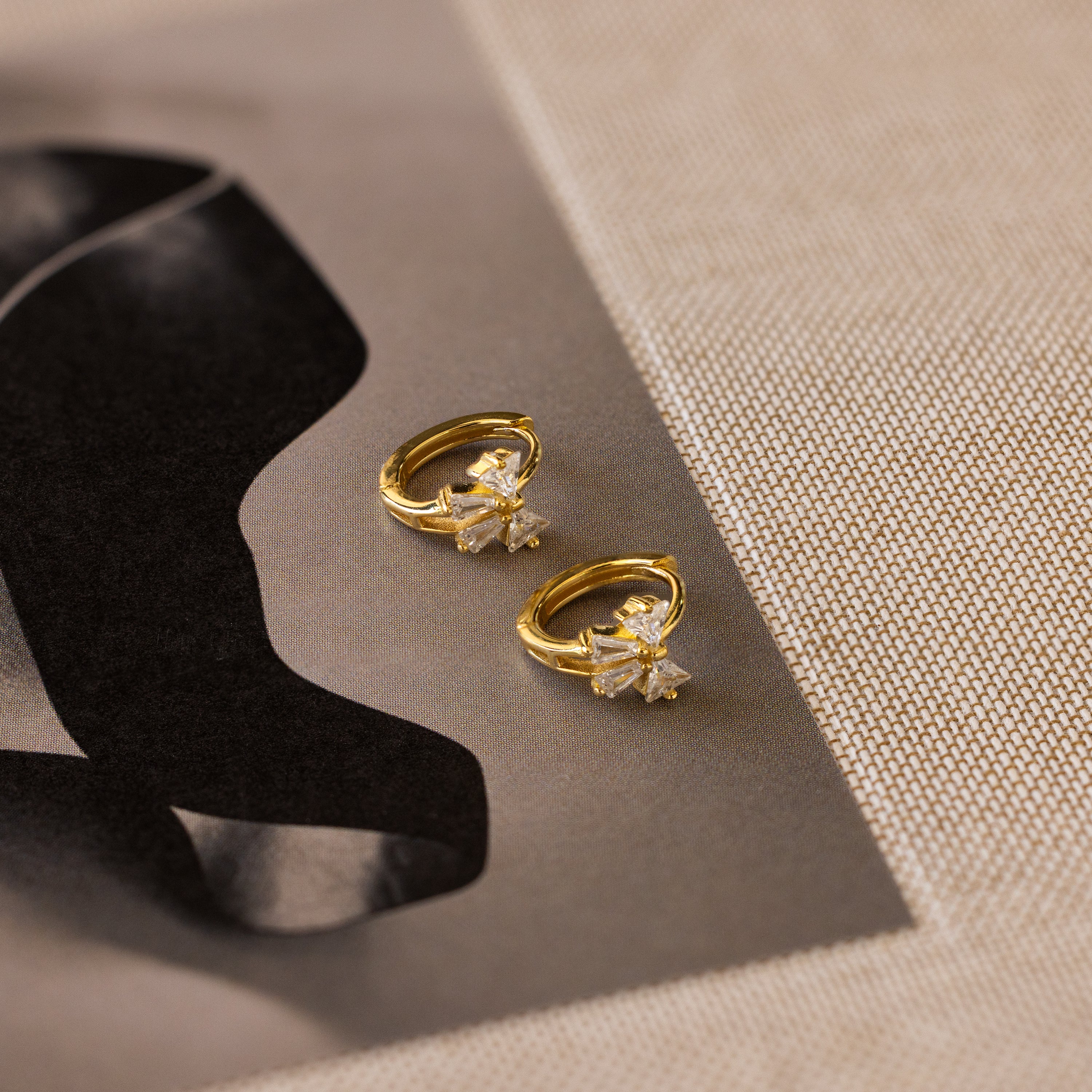 Diamond Ribbon Bow Huggies in 18K Gold - Image 5
