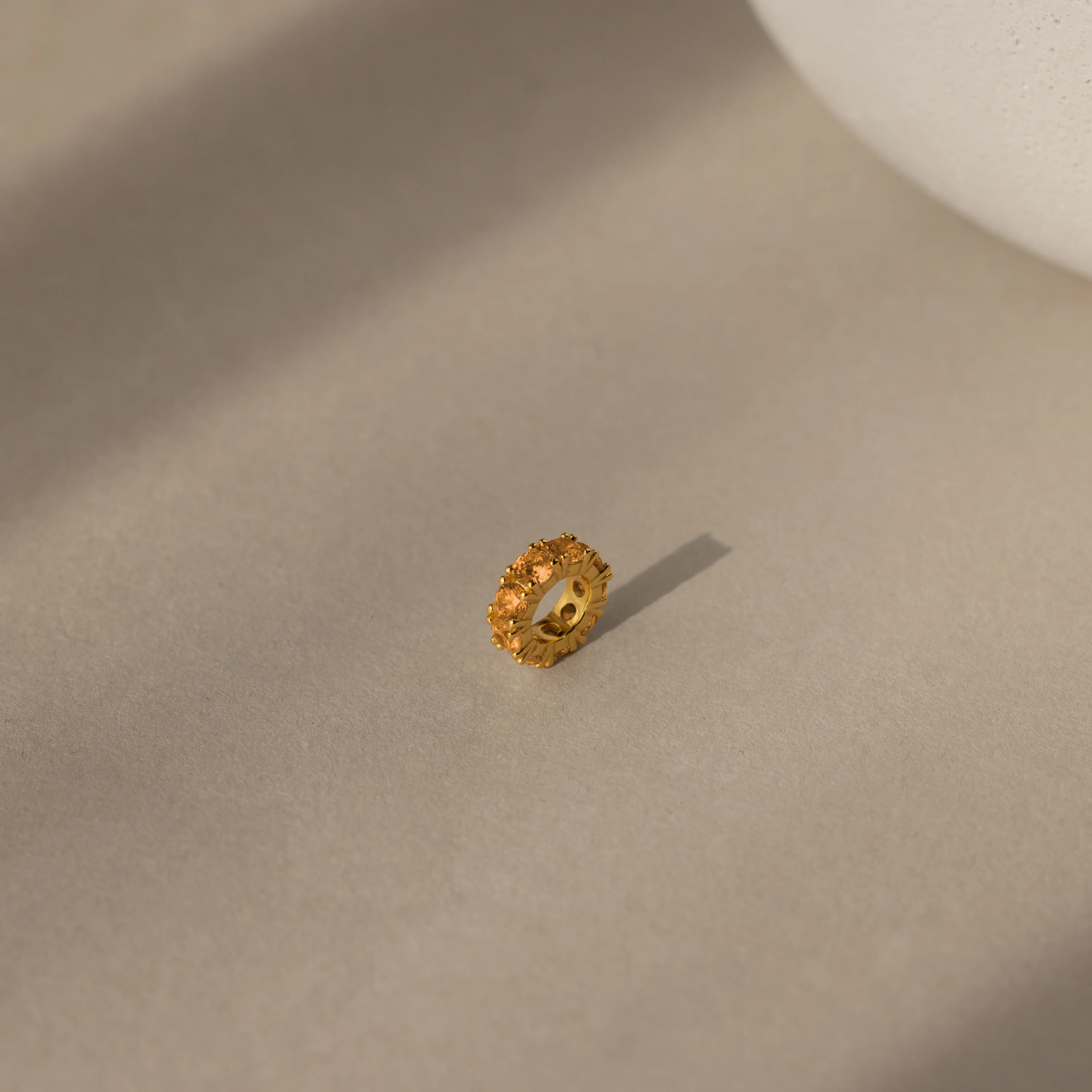Infinity Topaz Charm