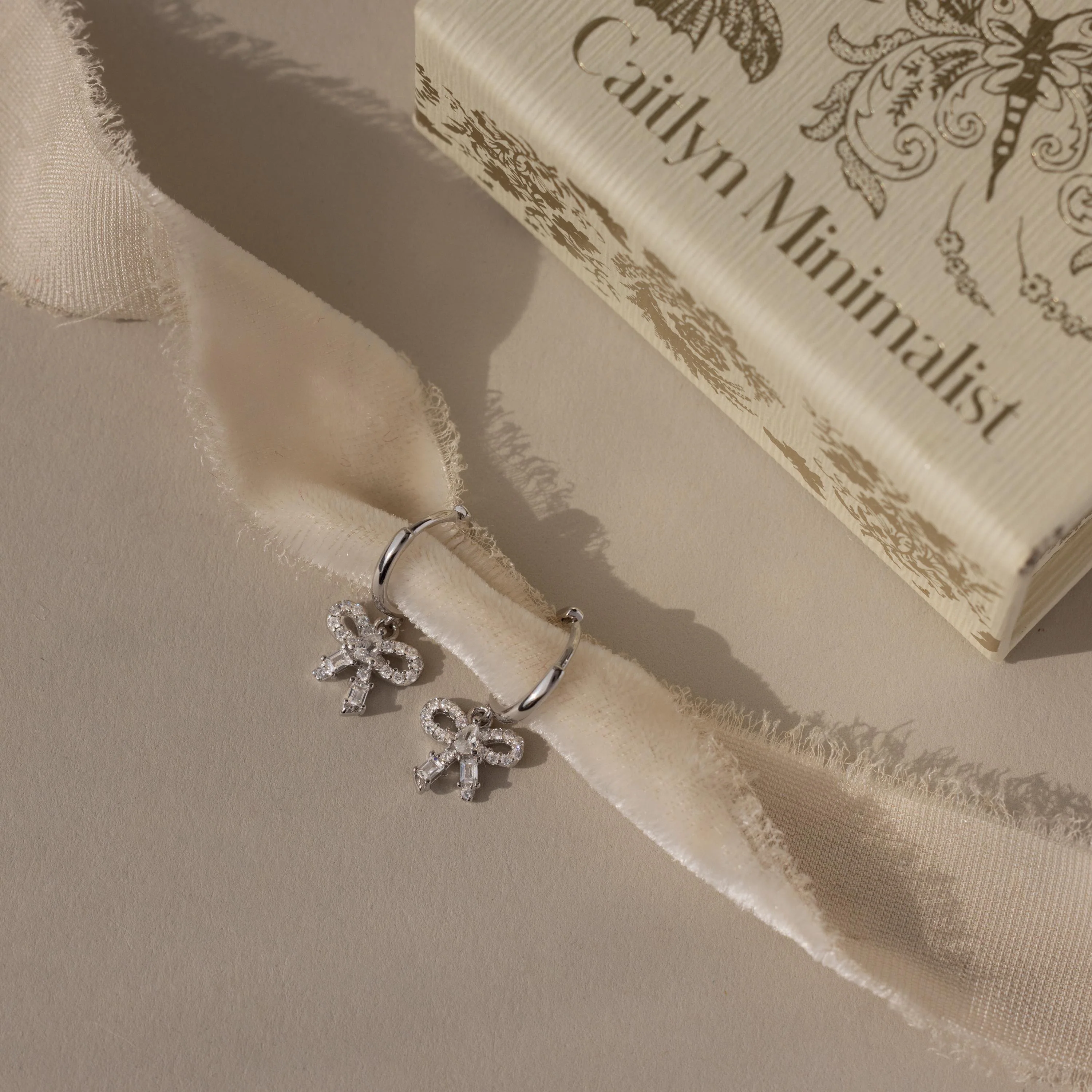 Pave Bow Charm Hoops in Silver - Image 5