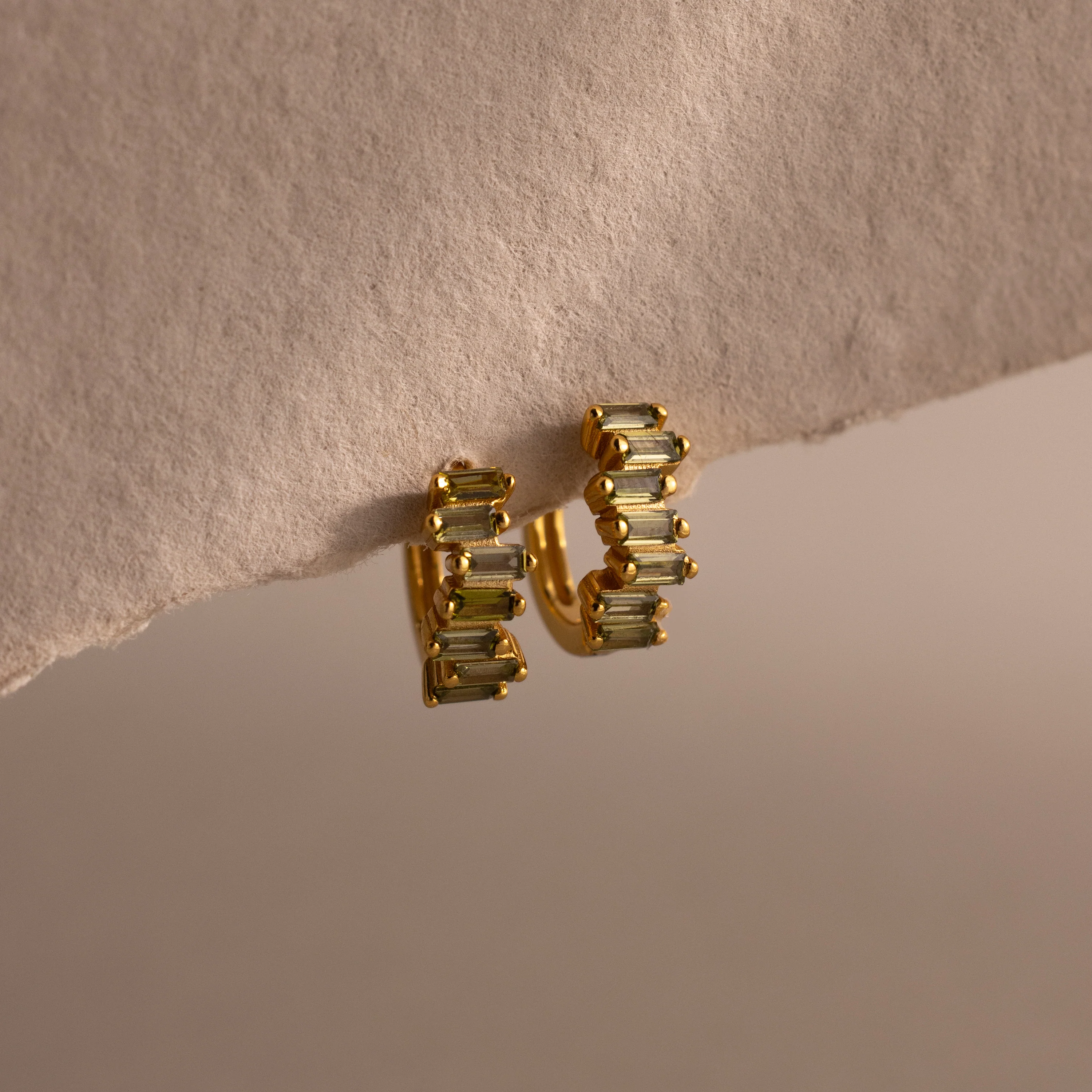 Staggered Baguette Peridot Huggies