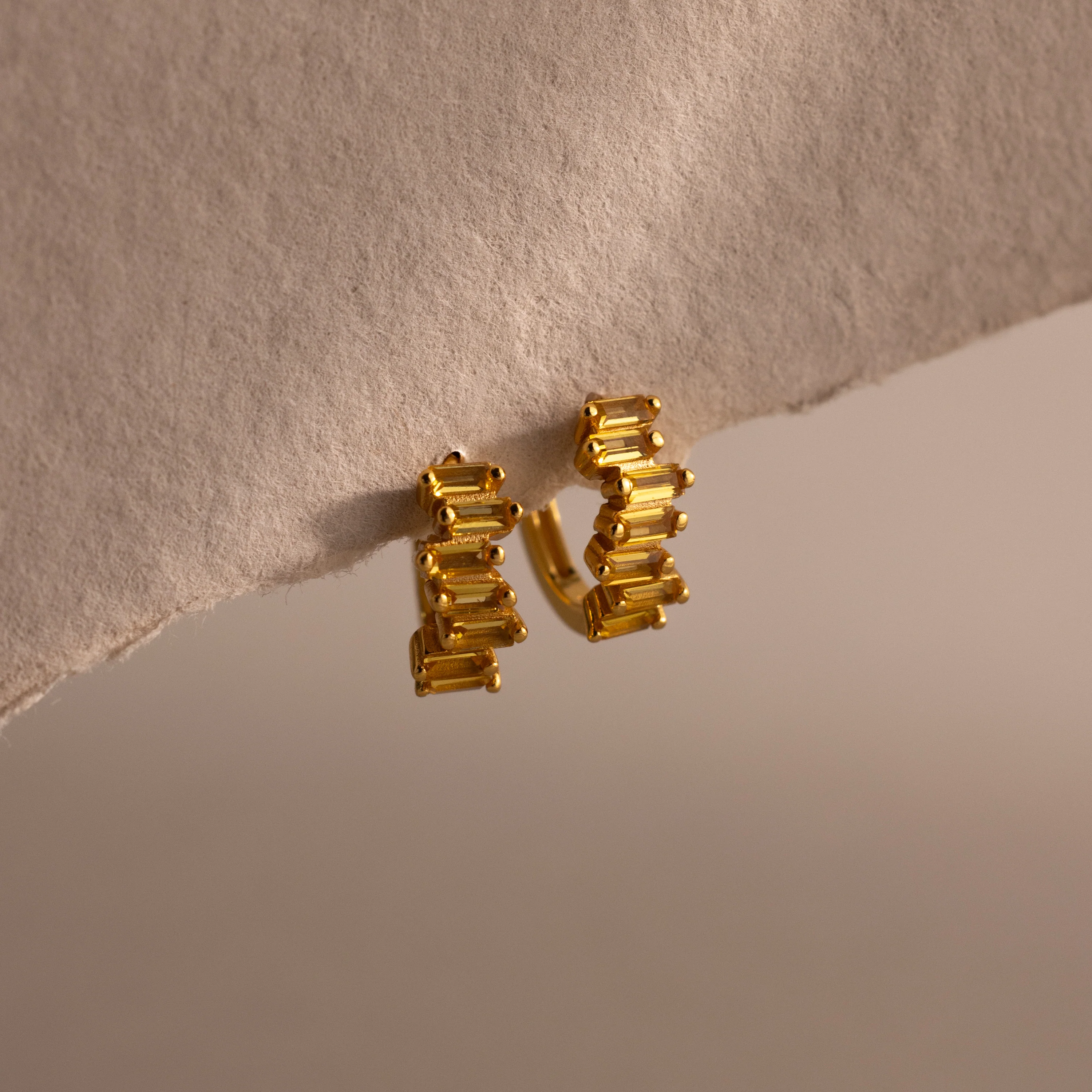 Staggered Baguette Topaz Huggies
