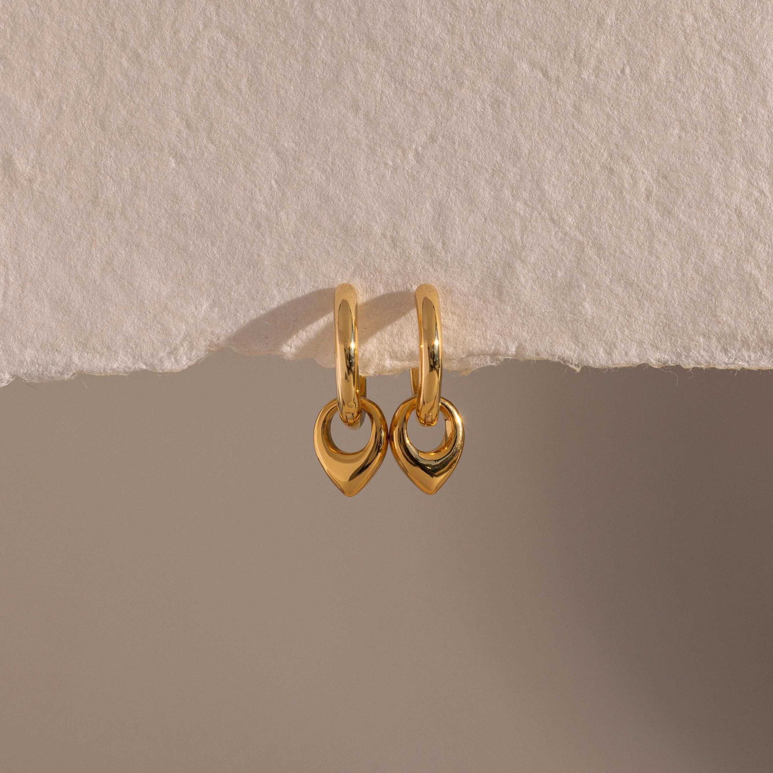 Tiny Teardrop Huggies in 18K Gold