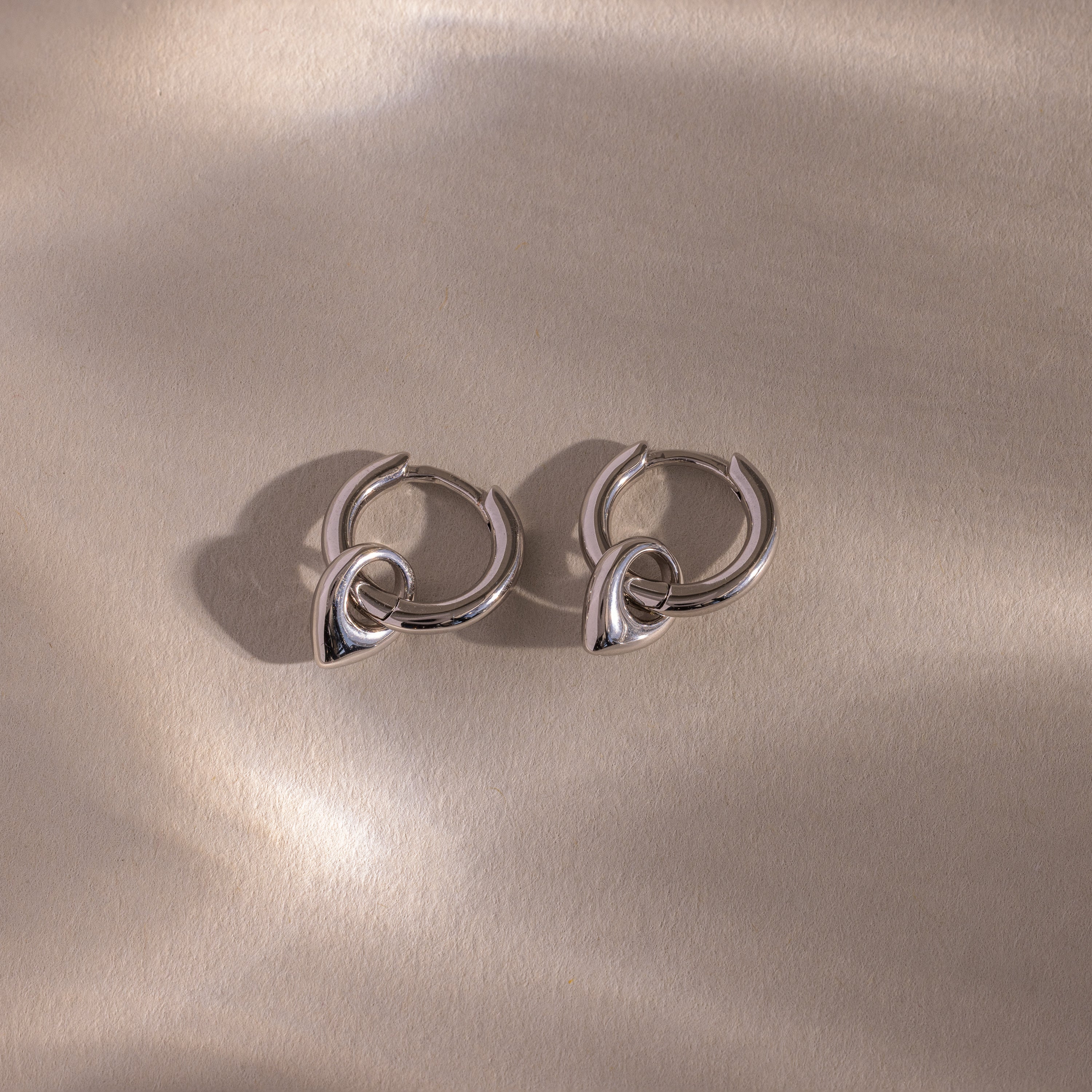 Tiny Teardrop Huggies in Silver - Image 3